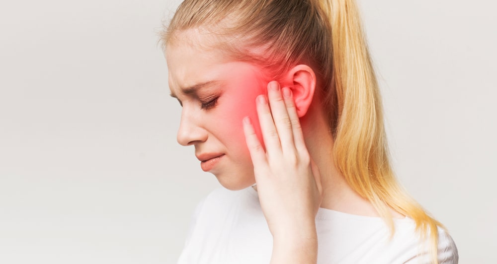 girl suffering from a toothache.